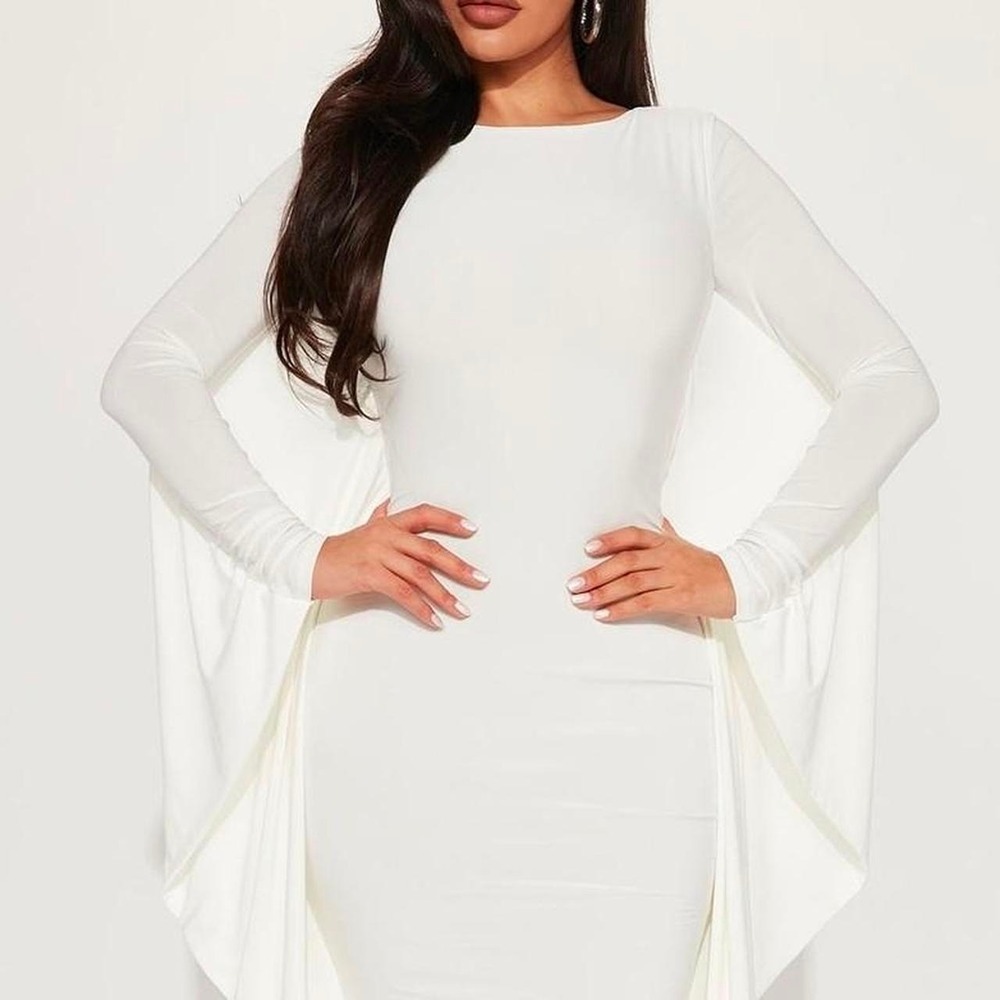 White bodycon dress with cape sleeves